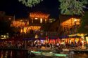 Outdoor dining along the River Walk in San Antonio, Texas, USA. Police patrol passing by.