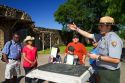 Park ranger informing tourists at the San Antonio Missions National Historical Park located in San Antonio, Texas, USA.