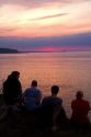 People watch the sunset on Lake Superior at Marquette, Michigan, USA.