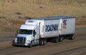 Semi truck hauling a double trailer on Interstate 84 near Boise, Idaho, USA.