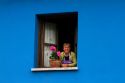 Spanish woman in the window of her home in the municipality of Cangas de Onis in Asturias, Spain. MR