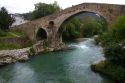 Arched Roman Bridge spanning the Sella River in the municipality of Cangas de Onis in Asturias, Spain.