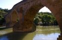 Six-arched Roman bridge spanning the Arga River on the Way of St. James pilgrimage route in Puente La Reina, Navarra, Spain.