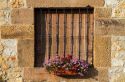 Flower pots in the window of a building in the village of Santillana del Mar, Cantabria, Spain.