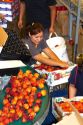 Workers sort peaches at the Symms Fruit Ranch packing facility near Sunny Slope, Idaho, USA.