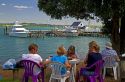 People eating outdoors in the waterfront town of Russell on the Bay of Islands, North Island, New Zealand.