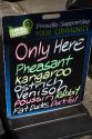Menu board advertising exotic meats available at a butcher shop in the town of Kawakawa, North Island, New Zealand.