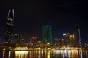 Night view of city lights reflected on the Saigon River in Ho Chi Minh City, Vietnam.