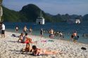 Tourists sunbathe on the beach in Ha Long Bay, Vietnam.