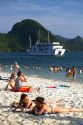 Tourists sunbathe on the beach in Ha Long Bay, Vietnam.