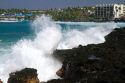 Waves crash along the rocky coast at Kailua-Kona on the Big Island of Hawaii, USA.