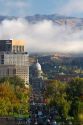 View of capital boulevard and the Idaho state capitol building on a misty morning in downtown Boise, Idaho, USA.