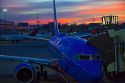 Sunrise over an airliner at Logan International Airport in East Boston, Massachusetts, USA.