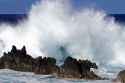 Waves crash along the rocky coast  on the Big Island of Hawaii, USA.