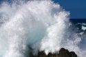 Waves crash along the rocky coast  on the Big Island of Hawaii, USA.